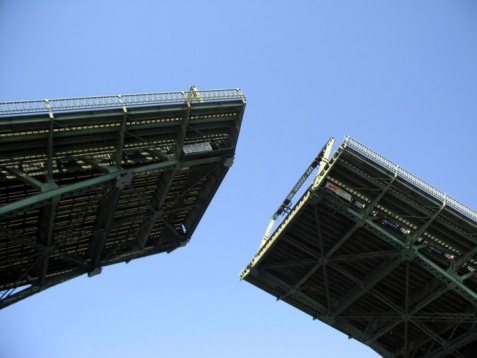 Drawbridge going up as seen from a boat deck.  Taken in Seattle, WA.