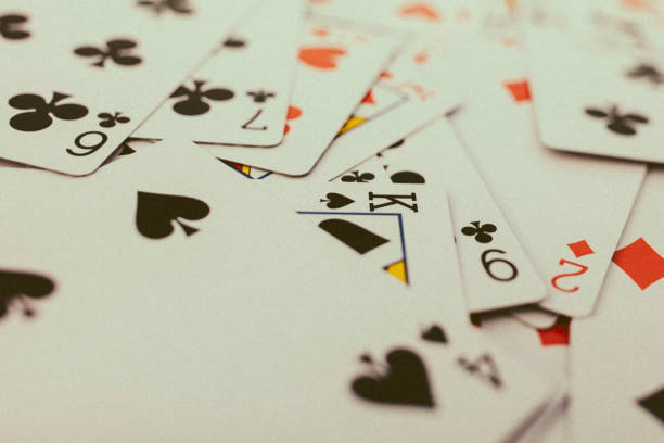 istock Background of playing cards, all spread on a table. 894662938