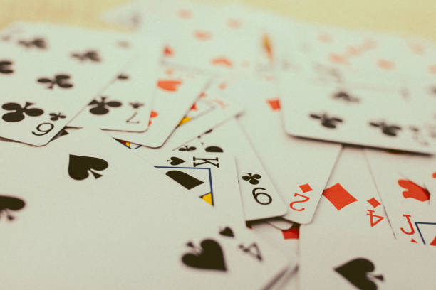 istock Background of playing cards, all spread on a table. 894662950