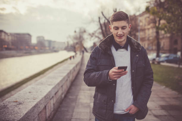 istock Cute young guy on the phone 894665390