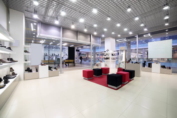 interior of shoe store in modern european mall - light shop imagens e fotografias de stock