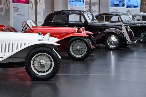Milan, Italy - February 24th, 2016: Exposition of classic Alfa Romeo vehicles in the car showroom. On the first plan we see the Alfa Romeo 6C 1750 Gran Sport (1931). These vehicles are the ones of the most wanted and rare classic cars with 30s.