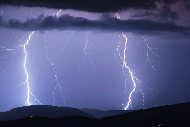 istock Beautiful lightning strikes over Italy 894668036