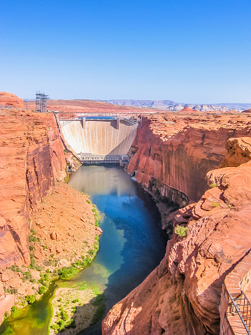 Glen Canyon Dam of Colorado River in northern Arizona, United States. Glen Canyon Dam forms the man-made Lake Powell, one of the largest reservoirs in the USA. Vertical shot.