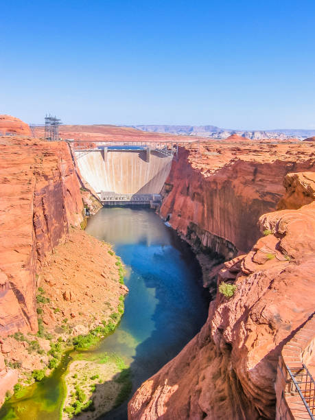 Glen Canyon Dam Glen Canyon Dam of Colorado River in northern Arizona, United States. Glen Canyon Dam forms the man-made Lake Powell, one of the largest reservoirs in the USA. Vertical shot. glen canyon dam stock pictures, royalty-free photos & images