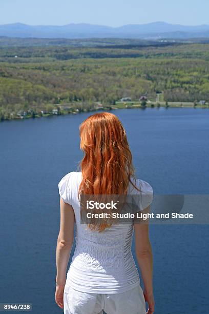 Redhaired Girl Looking Over Blue Lake Stock Photo - Download Image Now - Women, Redhead, Dyed Red Hair
