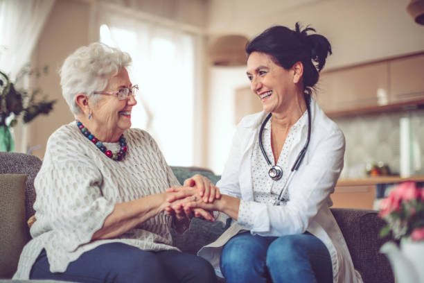 istock Social worker is visiting a senior woman 894675814