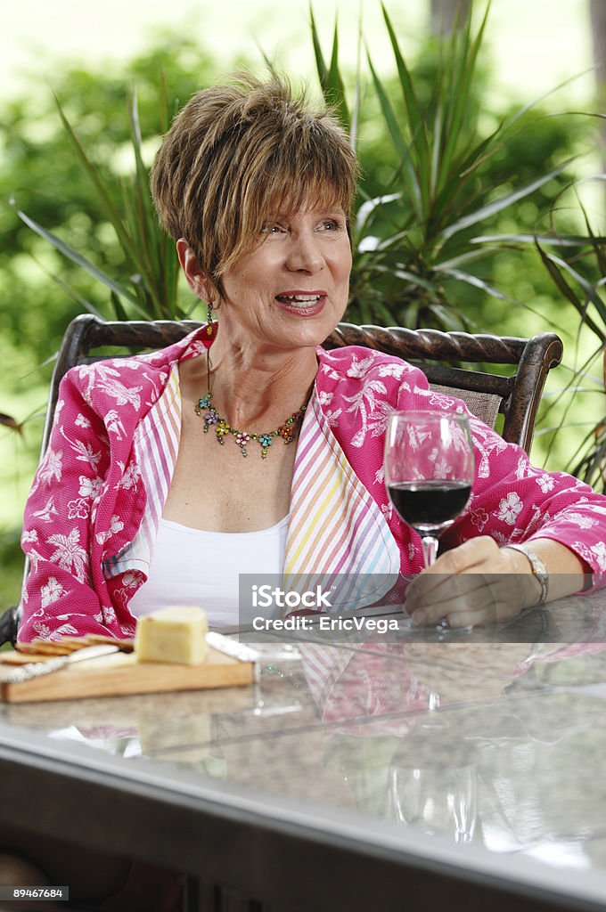 Enjoying herself Enjoying herself. 50-54 Years Stock Photo