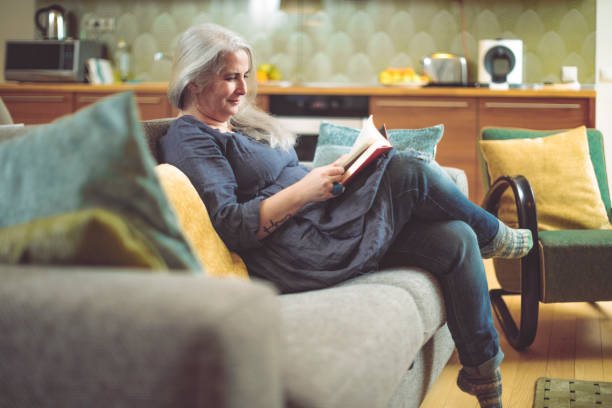 istock Mature woman at home 894678414