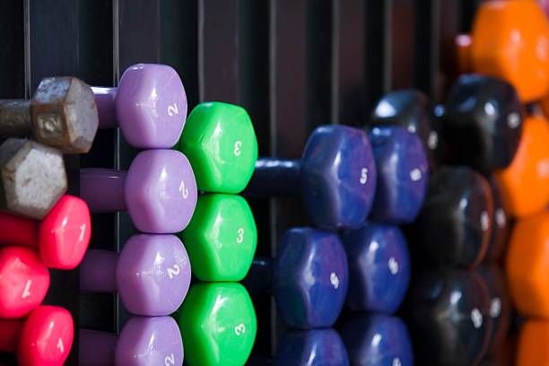 Different color and weight dumbbells at a gym