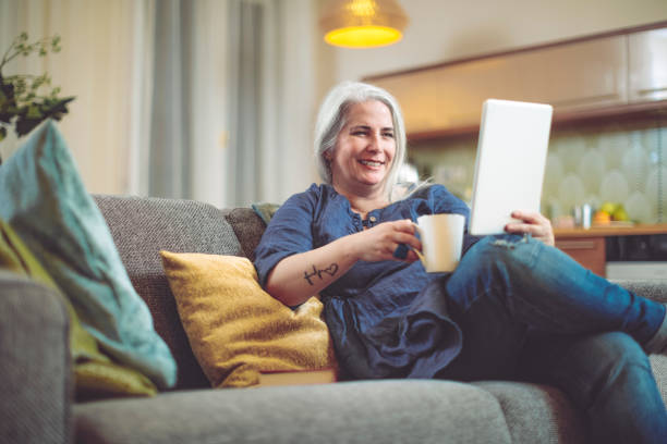 istock Mature woman at home 894685566