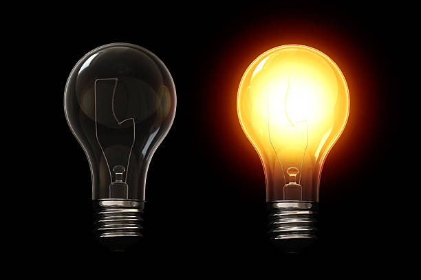 Light bulb isolated over a black background. stock photo