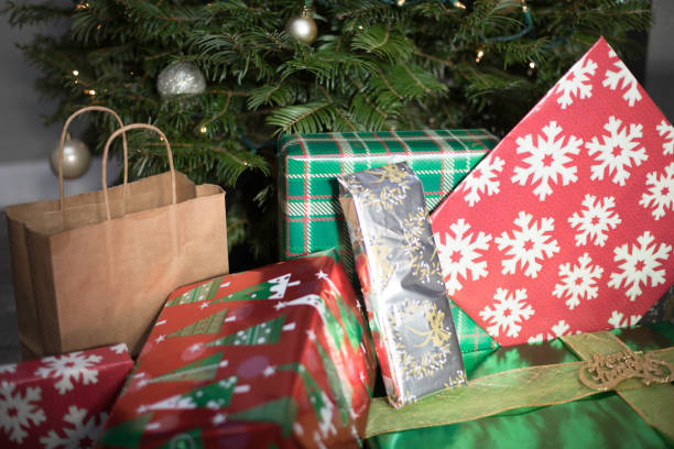istock Gifts Presents In Front Of Tree 894690792