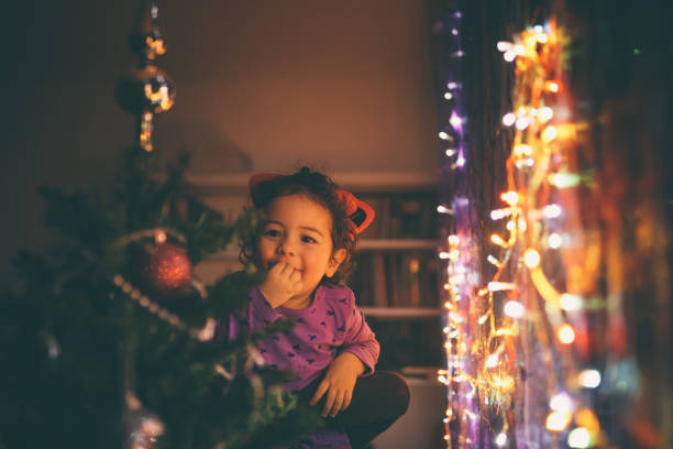 istock Cute little girl with Christmas Tree 894696446