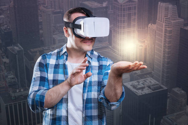 istock Astonished happy man exploring a virtual world 894699824