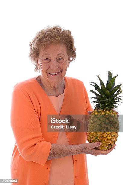 Woman With Pineapple Stock Photo - Download Image Now - Active Seniors, Adult, Color Image