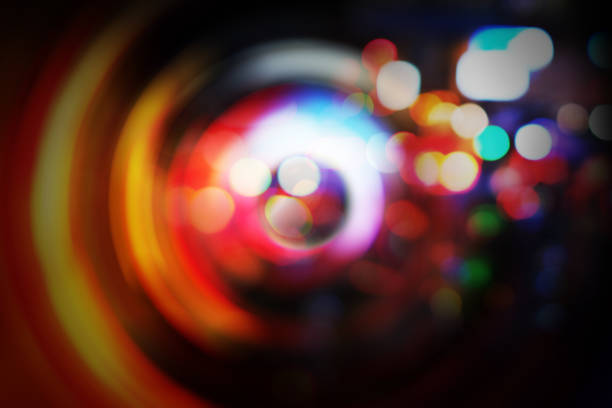 Violet purple and white festive abstract background with bokeh lights.