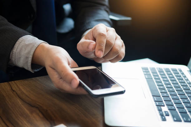 istock Midsection Of Businessman Using Technology At Desk In Office 894714428