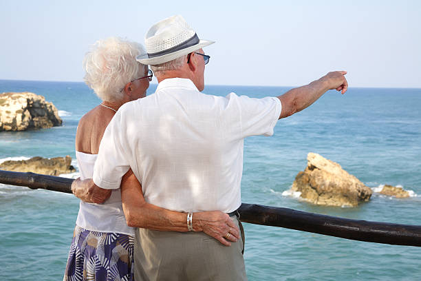 istock Elderly couple looking out across the ocean 89471999