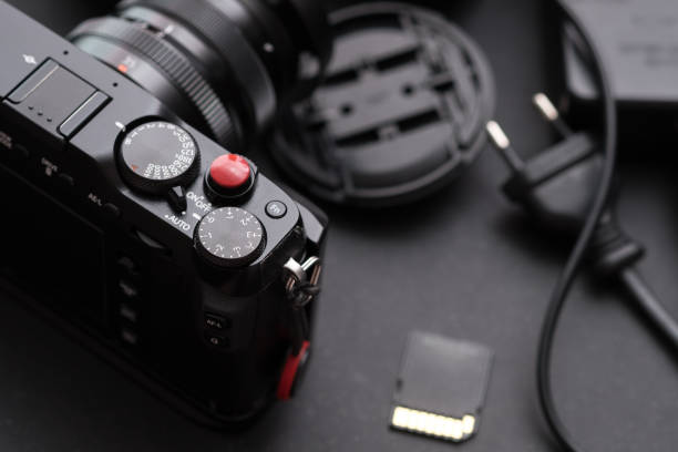 istock Digital camera close up on work desk. Photographic 894720512