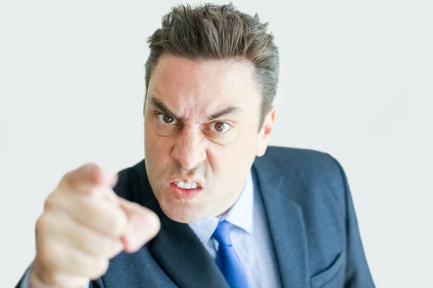 istock Angry Middle-aged Business Man Pointing at You 894720826