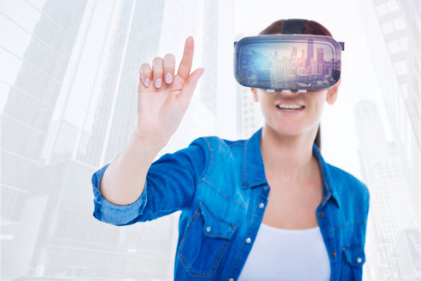istock Amused woman with virtual reality glasses 894735746