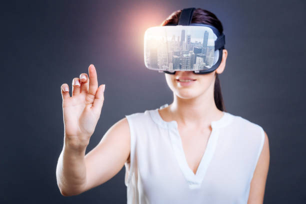 istock Excited woman looking through virtual mask 894735826