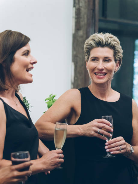 istock business people talking and drinking at bar 894736372