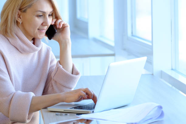 istock Businesswoman with smartphone in her office. 894736410