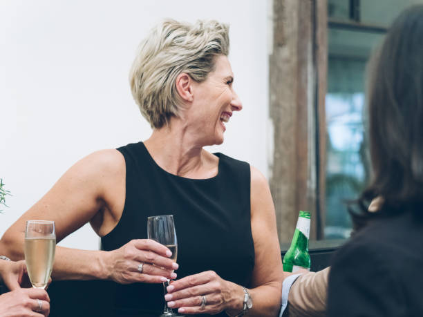 istock business people talking and drinking at bar 894738504