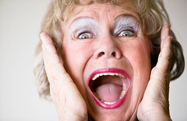 strillare donna anziana - shock grandmother surprise senior adult foto e immagini stock