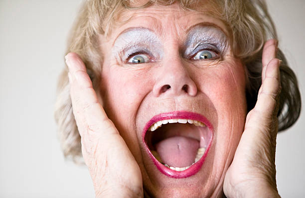 Screaming Senior Woman  women screaming surprise fear stock pictures, royalty-free photos & images