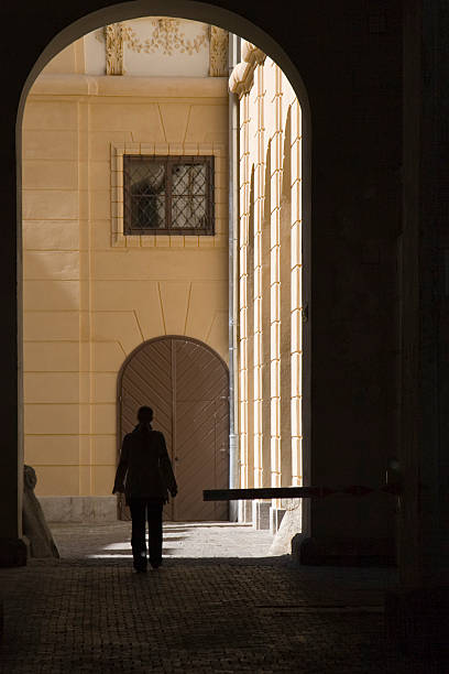 istock Woman entering a bright courtyard (Graz) 89474075