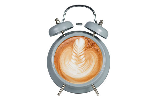 istock Hot coffee with frothy foam in blue alarmclock 894745958