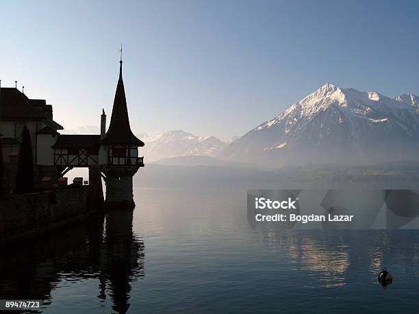 Oberhofen Castle And Lake Thunersee Switzerland Stock Photo - Download Image Now - At The Edge Of, Back Lit, Blue