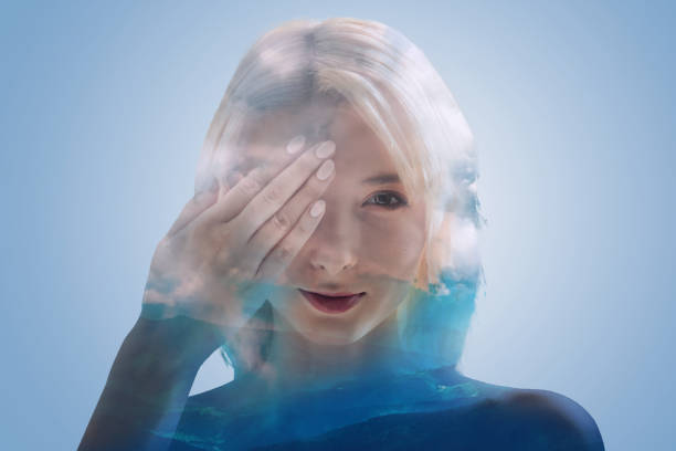 istock Relaxed blonde girl closing her eye with one hand 894774270