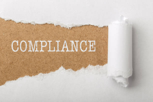 istock Paper Tear With Word Compliance 894776946