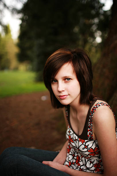 istock Brunette Female Sitting with Hands in Lap 89477736