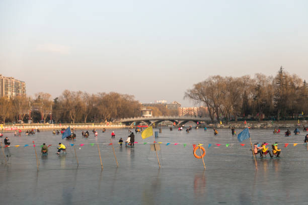 Beijing, China - January 14, 2016: People enjoy ice entertainment in a park
