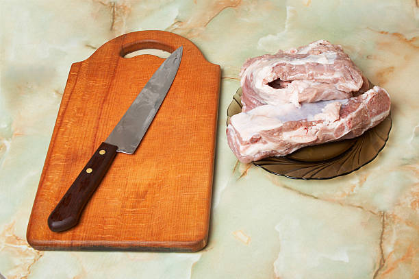 Meat, knife and board stock photo