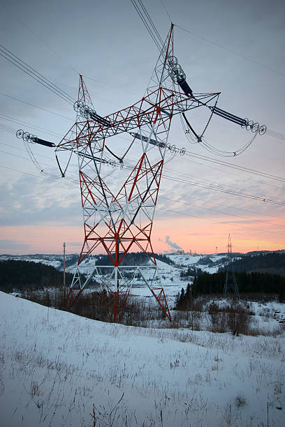 Electricity Pylon in Winter Sunset  buzbuzzer energy cable steel cable stock pictures, royalty-free photos & images
