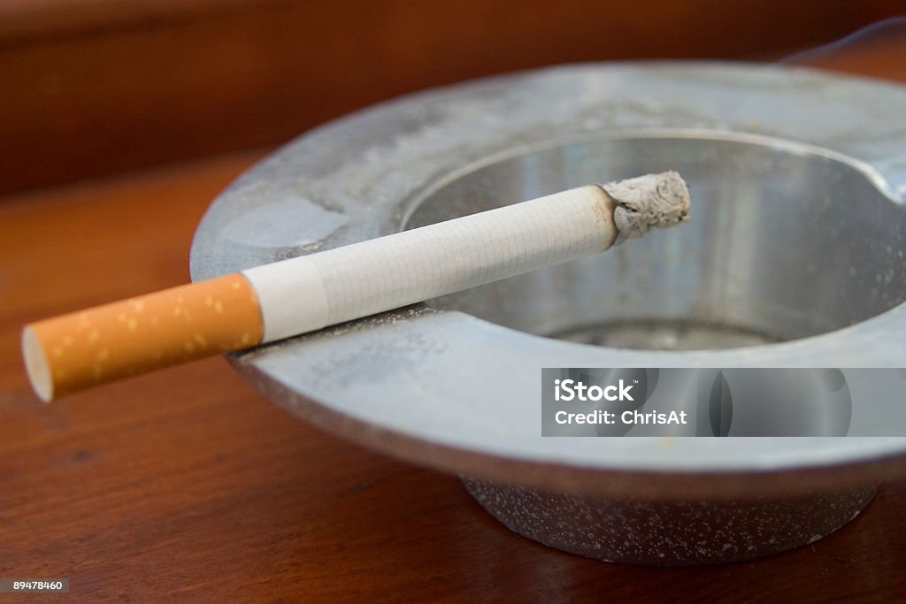 Smoking Burning cigarette smoking on ashtray Ashtray Stock Photo
