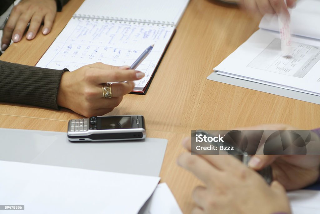 Hands and mobiles in the office  Business Stock Photo