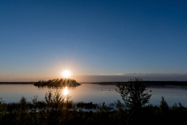istock Raspberry Island, Astotin Lake, at sunset in Elk Island National Park, Canada 894792204