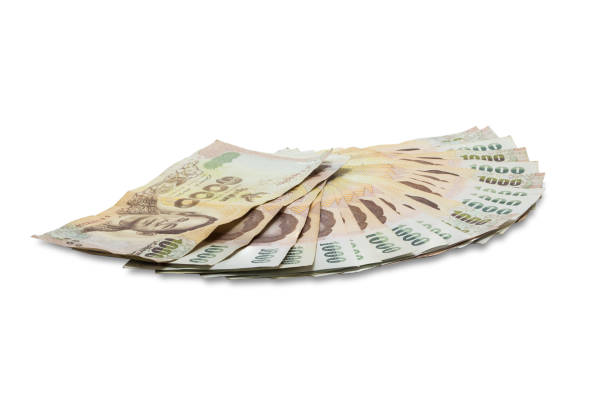 istock 1000 bath Thai banknotes isolated on white background. Banknote Exchange in Thailand 894794286