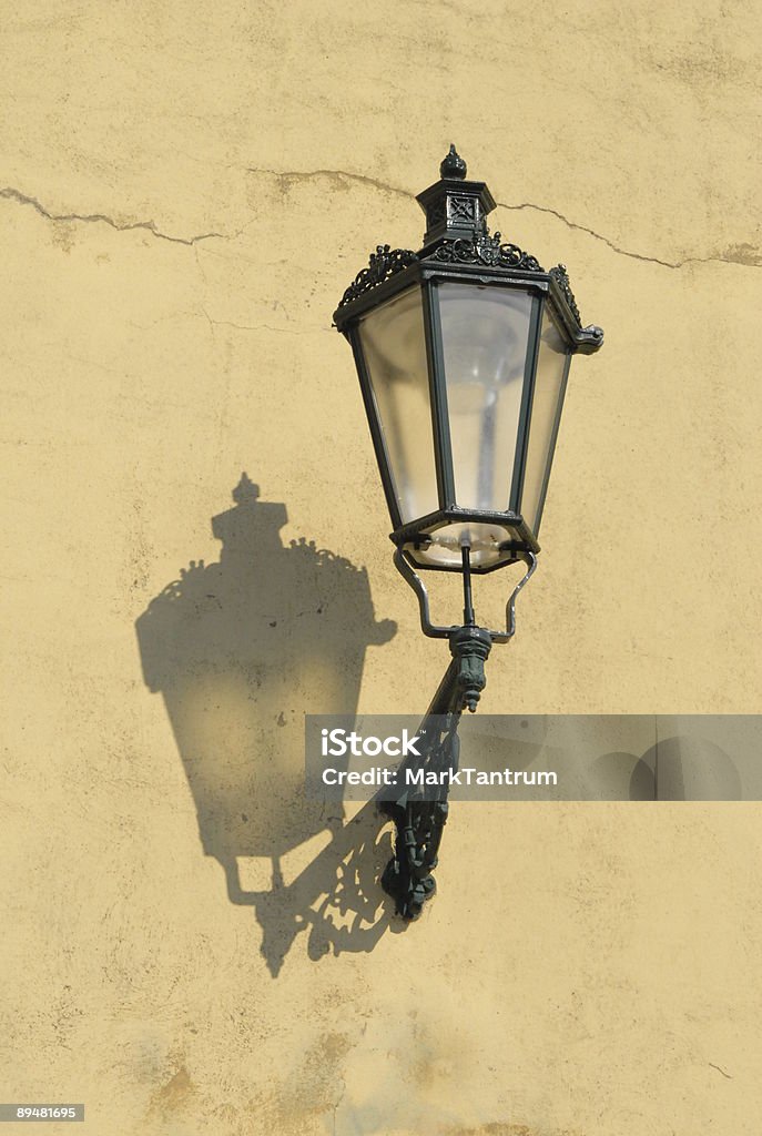 Street lamp on yellow wall, Prague, Czech Republic  Capital Cities Stock Photo