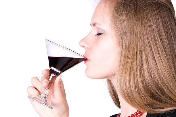 Young woman drinking wine stock photo