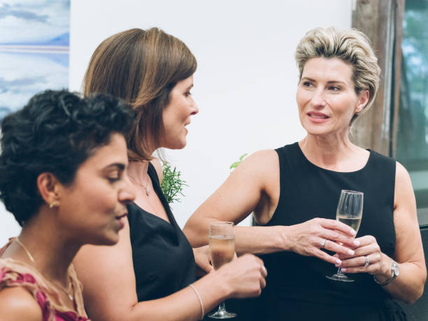 istock business people talking and drinking at bar 894833498