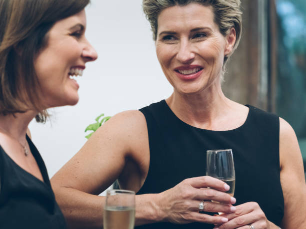 istock business people talking and drinking at bar 894833598