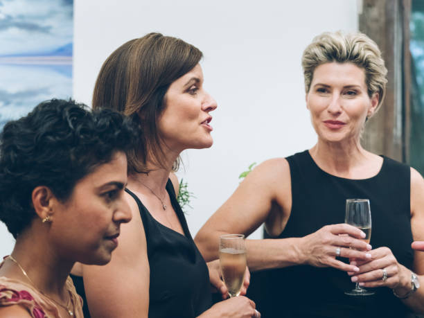 istock business people talking and drinking at bar 894833600